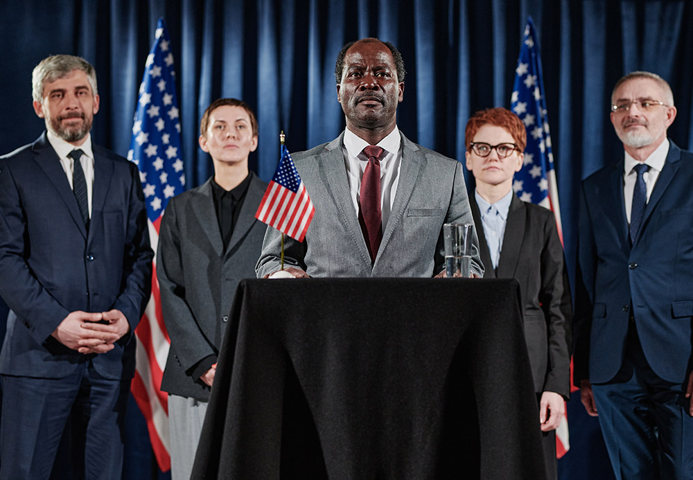 american-leader-with-his-group-at-conference-NGRTMWL